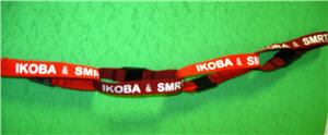 Red fabric wristbands tied together to make a chain