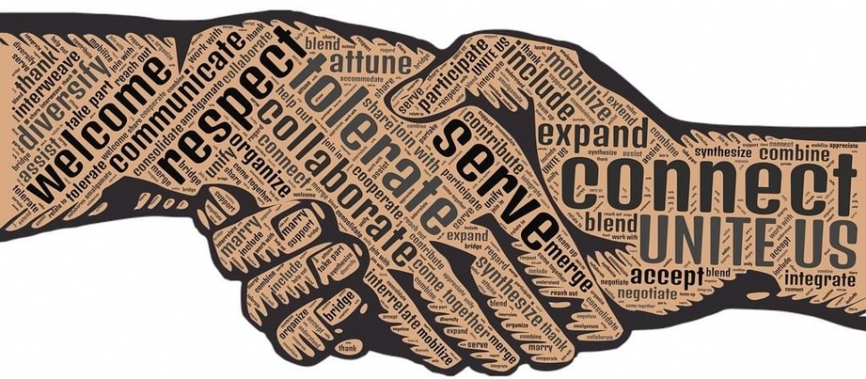 Illustration of a handshake with words that say, connect united. Two hands shaking each other over a word cloud.
